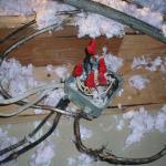 This open junction box was found under some blown in insultion. These 120 volt connections can and sometimes do spark and cause fires. Also some of the cables are old and frayed.